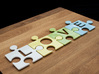 Puzzle Piece E - "Love-letters" 3d printed 4 puzzle pieces combined to write the word "love".