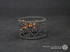 A large napkin ring with Mosaic-3b 3d printed The photo shows a print made of black strong and flexible incl. orange lacing.