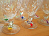 Ladybug Glass Tag 3d printed Various wine charms displayed on glass stems