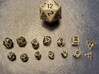 2x Tiny Polyhedral Dice Set, V4 (1.25x Scale) 3d printed A customer's 1.25x 'Tiny' dice between a regular d20 and the 1x scale 'Super Tiny'  dice.
