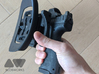 [Holster] BlackHawk Omnivore Release Extension  3d printed If initial thumb placement is incorrect, there's still a high chance of the button being hit. 