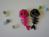 Mermaid Bone 3d printed Shown materials are Pink Strong & Flexible and Black Strong & Flexible dusted with gold spray