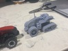 Claas Axion Terra Trac  3d printed sitting next to 1/64 magnum, cab removed