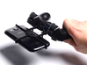 Controller mount for PS3 & Huawei P8 3d printed In hand - A Samsung Galaxy S3 and a black PS3 controller